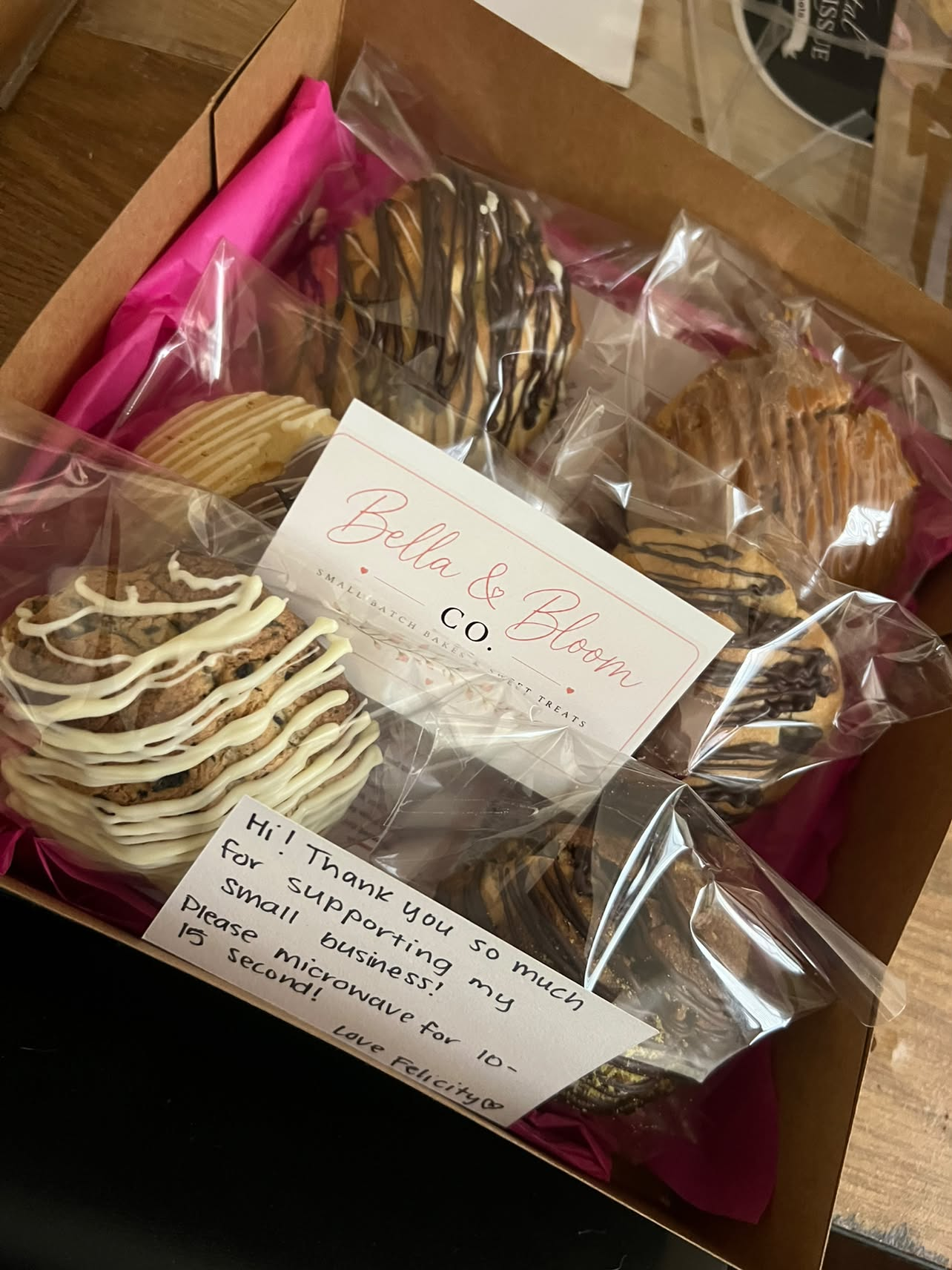 A signed Bella & Bloom Co. cookie box