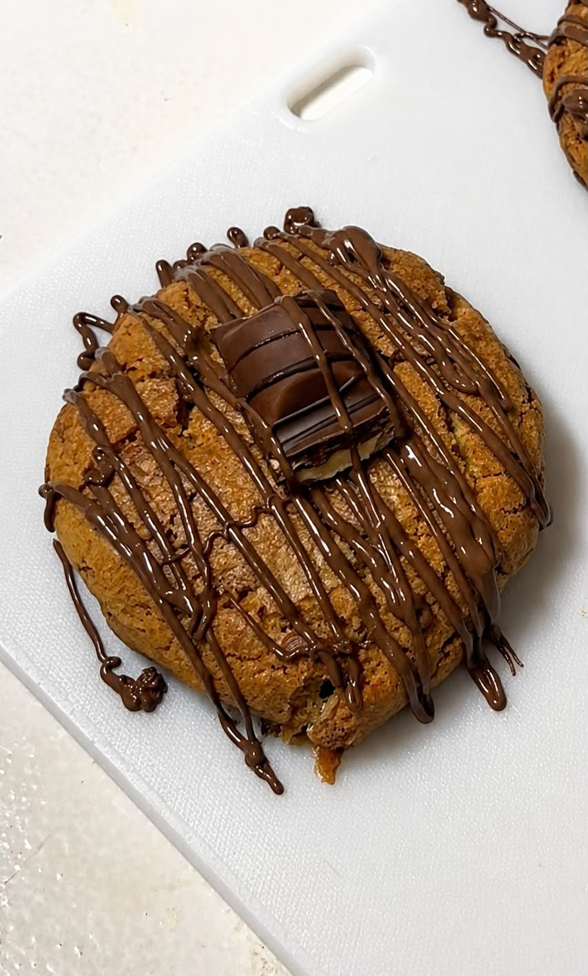 Loaded cookie drizzled with chocolate